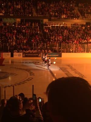 Kickoff ceremonies featuring pyrotechnics and flaming hockey sticks at the opening season 1st game.