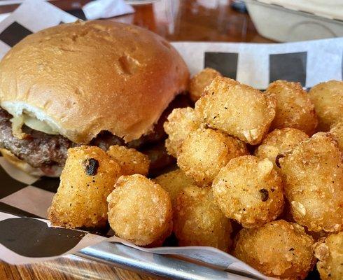 Hamburger with fried onions. Tater Tots with Cajun seasoning.