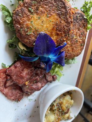 salmon cakes, breakfast potatoes and turkey bacon