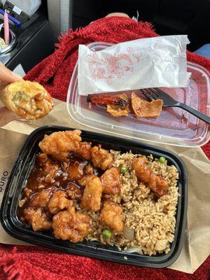 Orange chicken combo with pork fried rice and egg roll (already half eaten.. phone did not eat first)