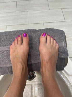 Beautiful shiny pink pedicure by Haley.