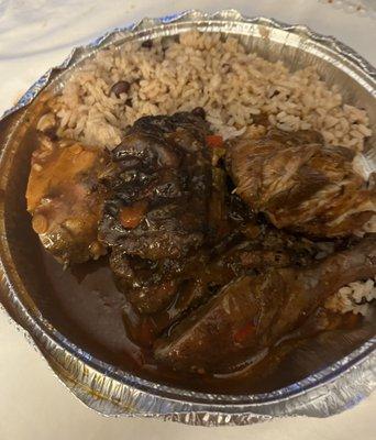 Make your mouth water Jerk Chicken w/ rice & peas.. Spicy and delicious..