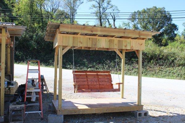 5' cedar swing in a 6' x 9' swing gazabo w/ a old tin roof.