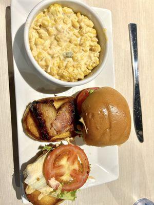 House-made Pork Belly Slider on toasted bun and street corn.