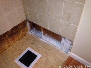 Tiles and shower floor pan had to be removed to expose and remove water and mold damage and one can see there's  been a leak previously