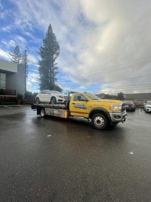 Car on the tow getting dropped off