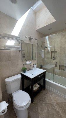 Bathroom with details under the sink and the shower