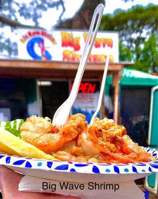 Garlic Butter Shrimp with Cesar Salad, Rice, & a small slice of pineapple.