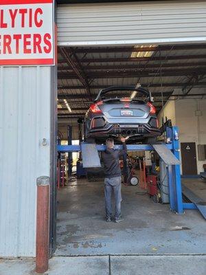 My car on the lift getting rattle checked out.