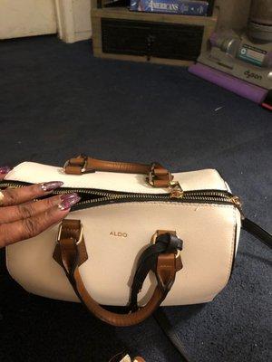 This is the purse With the issues ... zipper decided to not zip anymore .