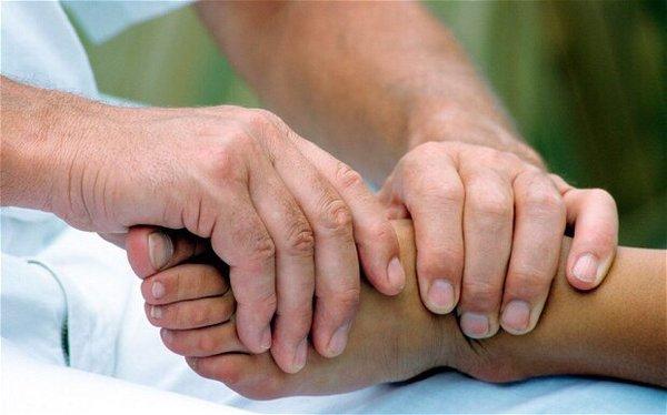 Reflexology therapy in the treatment of conditions associated with pain such as osteoarthritis, backache and cancers