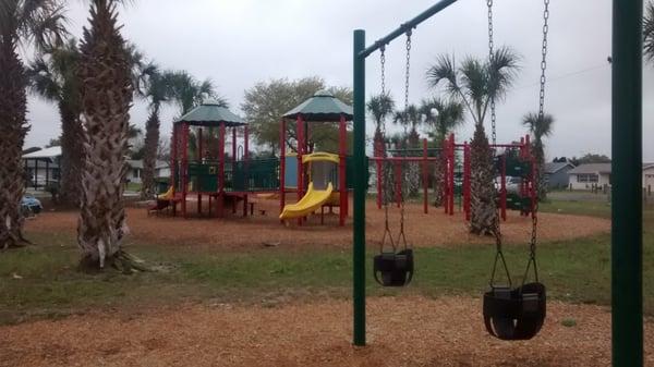 Swings and playground. There are also older kiddo swings and a swing for a handicapable kiddo. :)