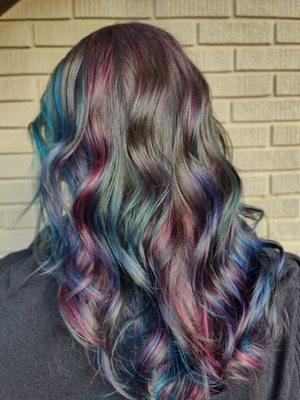 Dark hair with vivid peekaboo colors. oil slick hair color