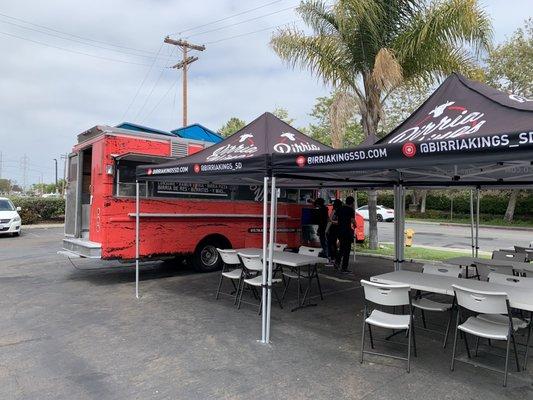 The truck with the outdoor dining.