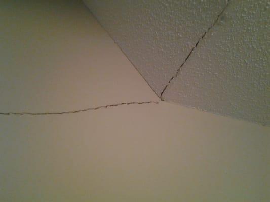 This crack in the ceiling and up the stairs in the sheet rock can be fixed by adjusting the height of your foundation