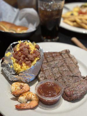 The 8oz Sirloin Steak with grilled shrimp Loaded Baked Potato