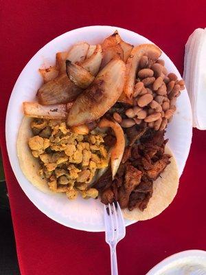 Asada, Pastor and Pollo tacos with grilled onions and beans thrown in for free. Superb! They also use homemade flour tortillas.