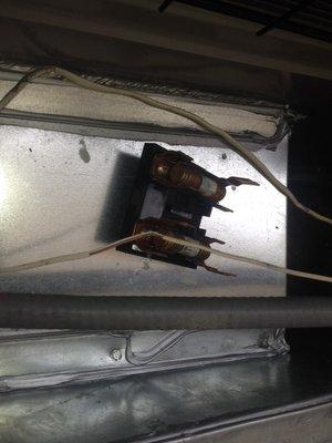 Unattached fuses just sitting on the newly installed furnace/air conditioner.