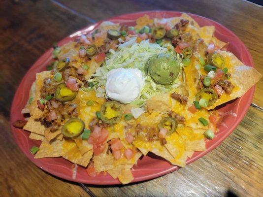 Nachos Fiesta comes with Sour Cream and Guacamole