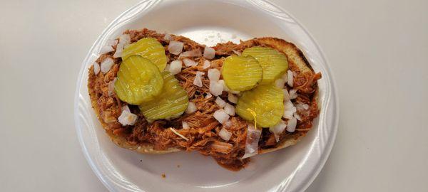 BBQ Pulled Pork with onions and pickles.