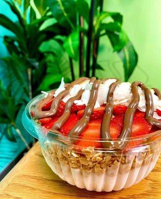 Coco Cabana bowl with coconut base. Toppings: granola, strawberry, coconut, banana, Nutella