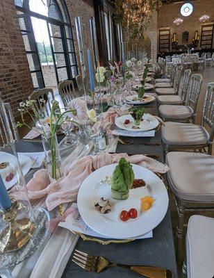 Our head table! We rented the napkins, utensils, chargers, taper candles + candleholders, and table runners from her.