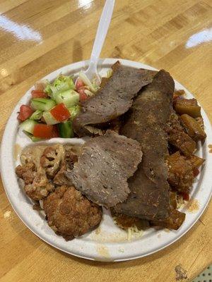 Eggplant stew with gyros and cauliflower stew and a Jerusalem salad with lemon juice