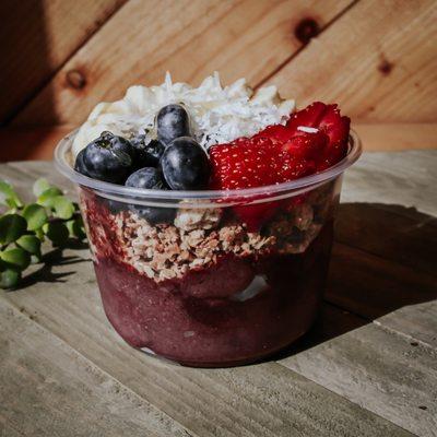 Acai bowls topped with housemade granola (gluten free), honey, coconut flakes, and fruits. Extra toppings - Peanut Butter or Cacao Nibs.