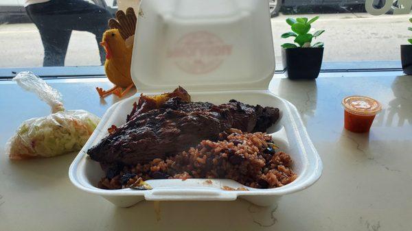 Carne asada, gallo pinto, and maduros