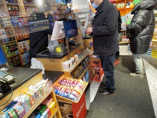 The cashiers at this store is providing plastic-bags to the customers, which is illegal in NYS