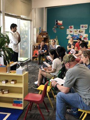 Parents participating in "Mindful Montessori" to increase parent awareness of Montessori pedagogy and theory.