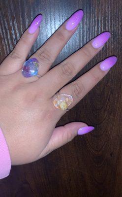 Purple and pink ombré with glitter in an almond shape nail set.