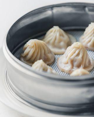 Our famous Xiao Long Baos (Chinese soup dumplings). Each steamed dumpling is filled with savory broth and delicious fresh meat filling.