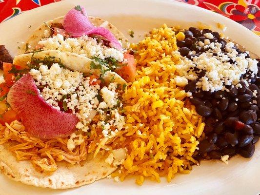 Chicken taco, Steak taco, rice and black beans with cheese.