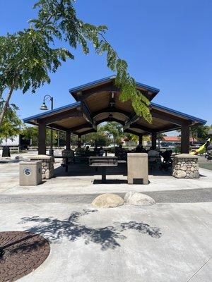 Large shaded open area with picnic tables