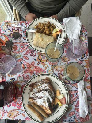 cinnamon french toast with sausage, and breakfast burrito with potatoes