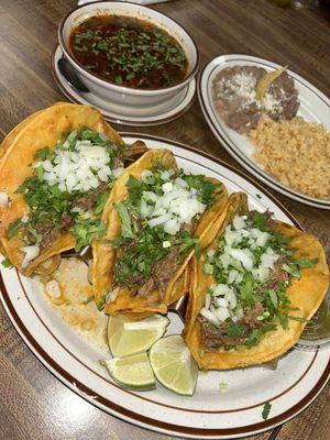 Birria tacos and consome