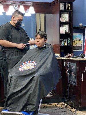 Joe giving my Son a haircut.