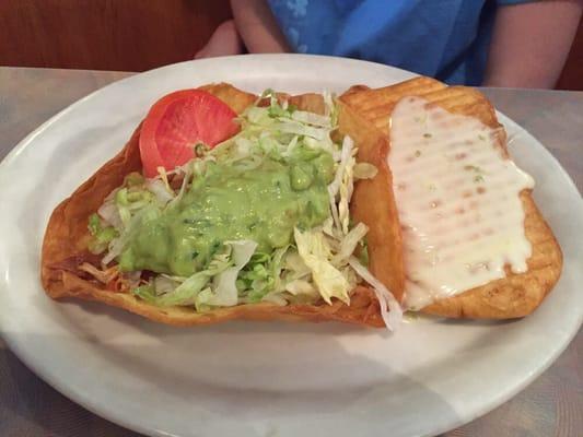 Chimichanga with cheese sauce on top. My daughter liked it.