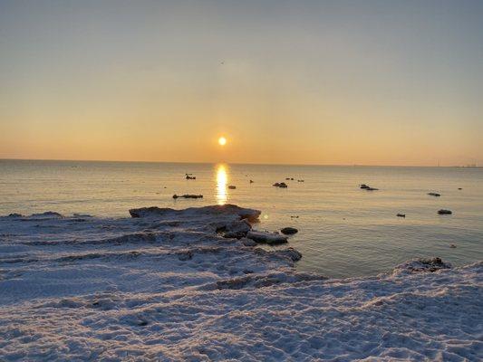 02/27/21 - Foster Avenue Beach just after sunrise, ice shelf on the left w/floating ice chunks in the lake