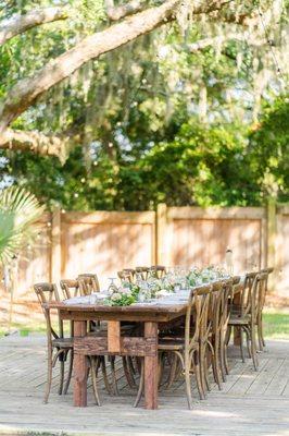 Greens and floral garland for this beautiful outdoor wedding reception