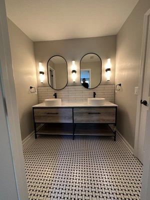 New vanity, tile flooring, paint, lighting, mirrors, plumbing