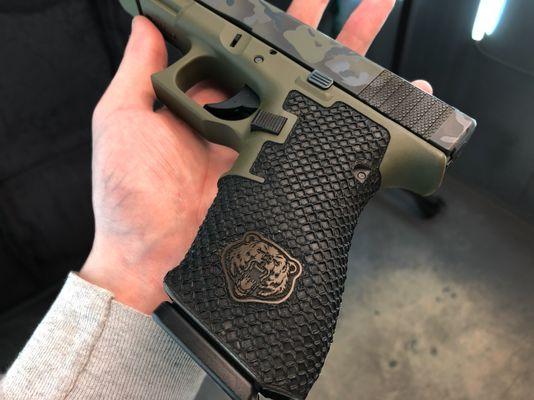 Customer supplied Glock 20 gen 4 with cerakote, stippling, frames and a custom bear icon.