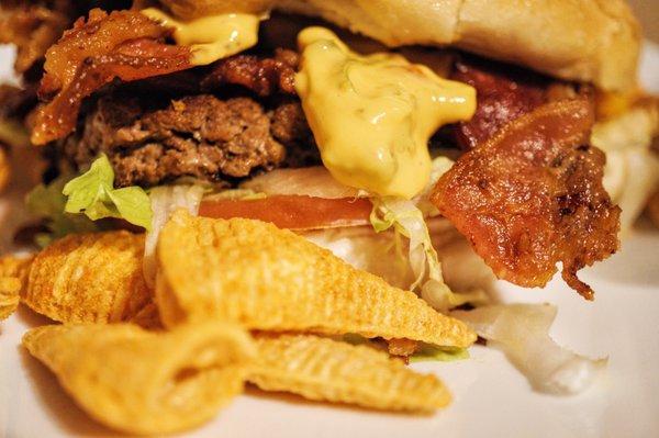 Closeup Bacon Cheeseburger + Nacho Bugles. Classic bodega eats. $4 total