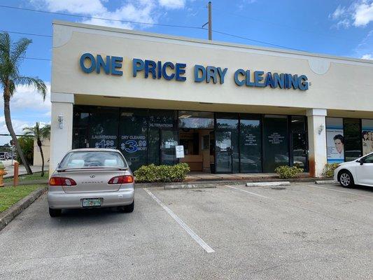 On the northwest corner of the strip mall with a couple reserved spots in front.