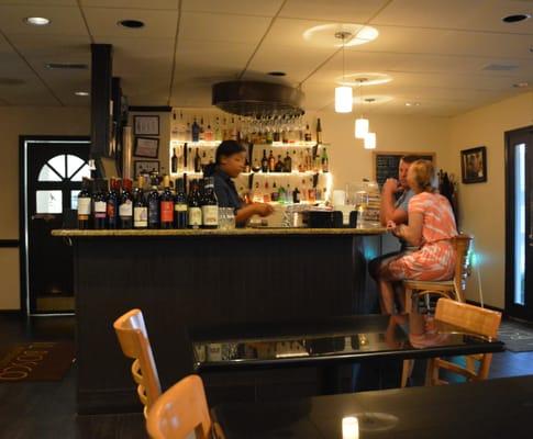 Others seeking shelter from the rain in a well stocked bar.