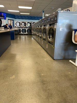 A row of very clean washing machines.