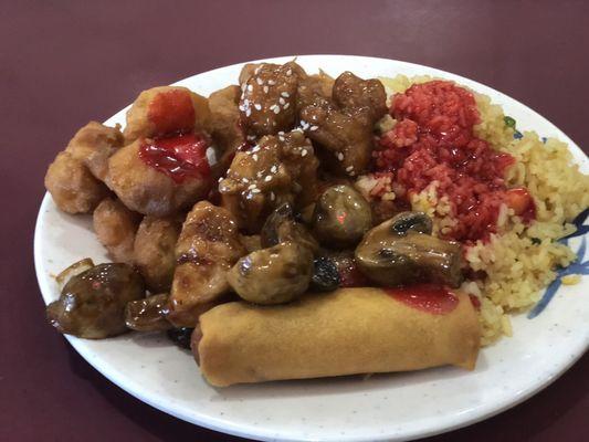 This is a mix of Sesame Chicken, Mushrooms, Egg Rolls and fried Rice.