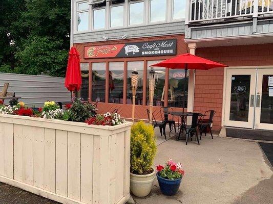 The view of the patio and front door from the parking lot at the Point Grove Rd location where we moved in spring 2020.