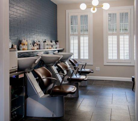 Sleek modern shampoo area